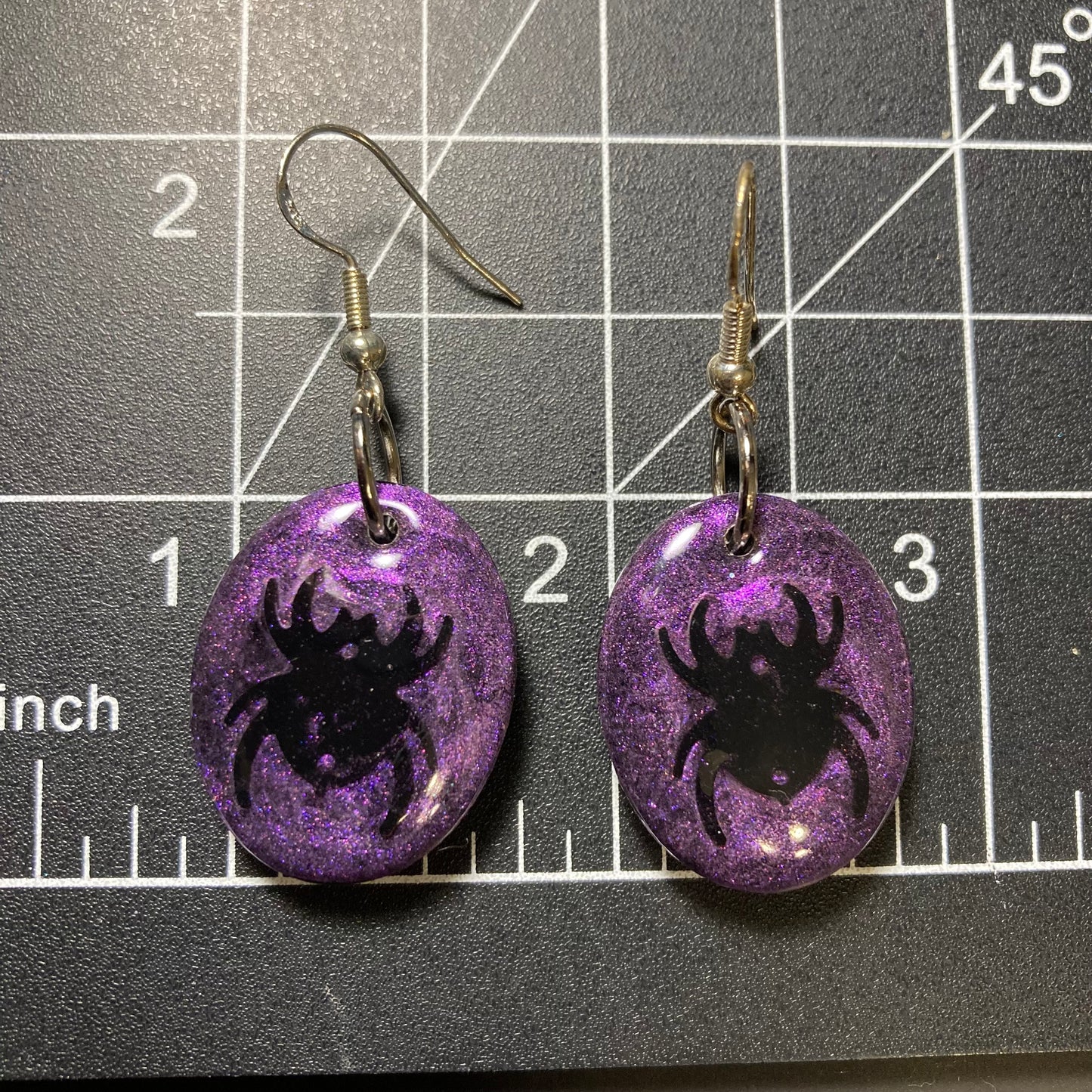 Purple spider earrings