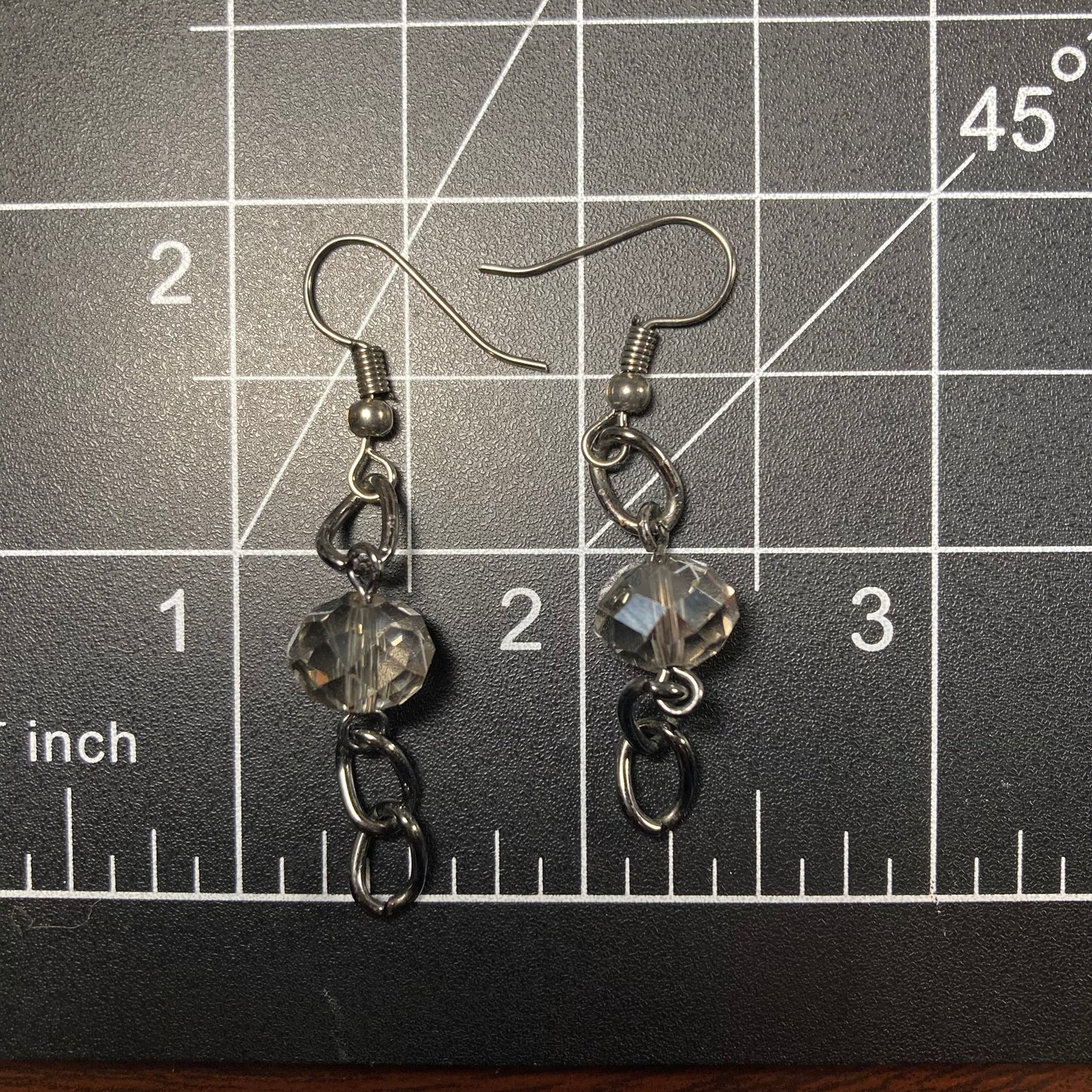 Beaded earrings on a dark silver chain