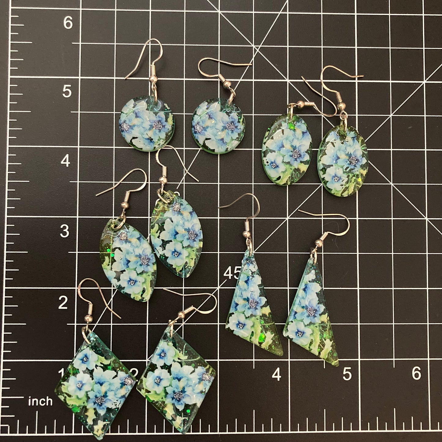 Floral drop earrings, green and blue