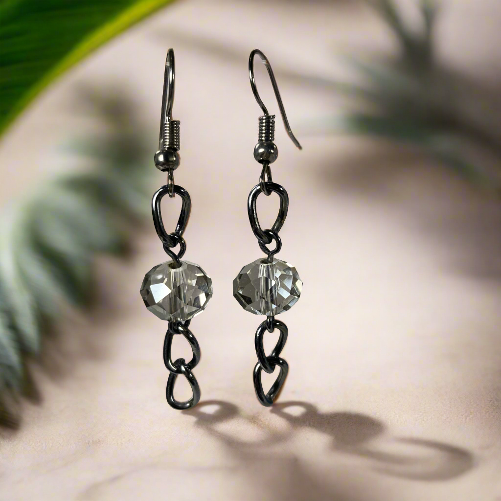 Beaded earrings on a dark silver chain