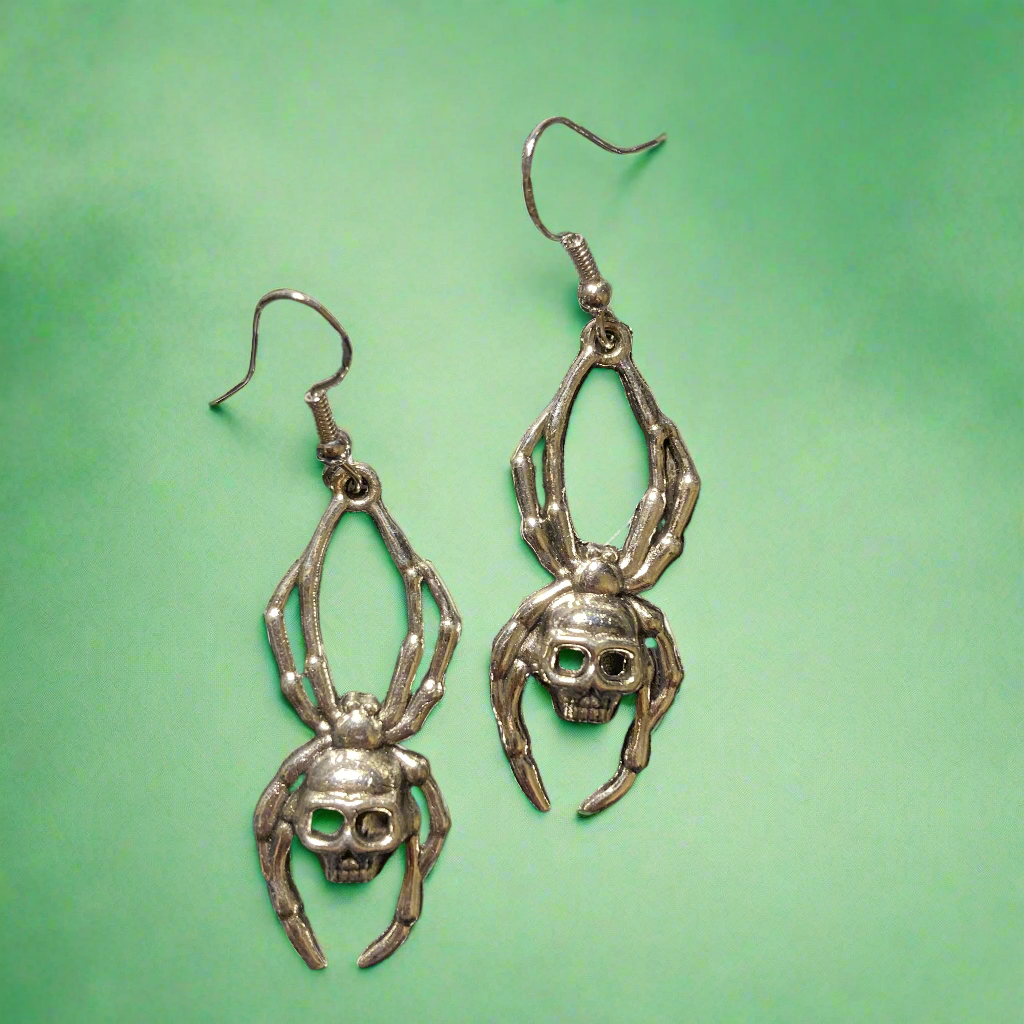 Spider with skull earrings