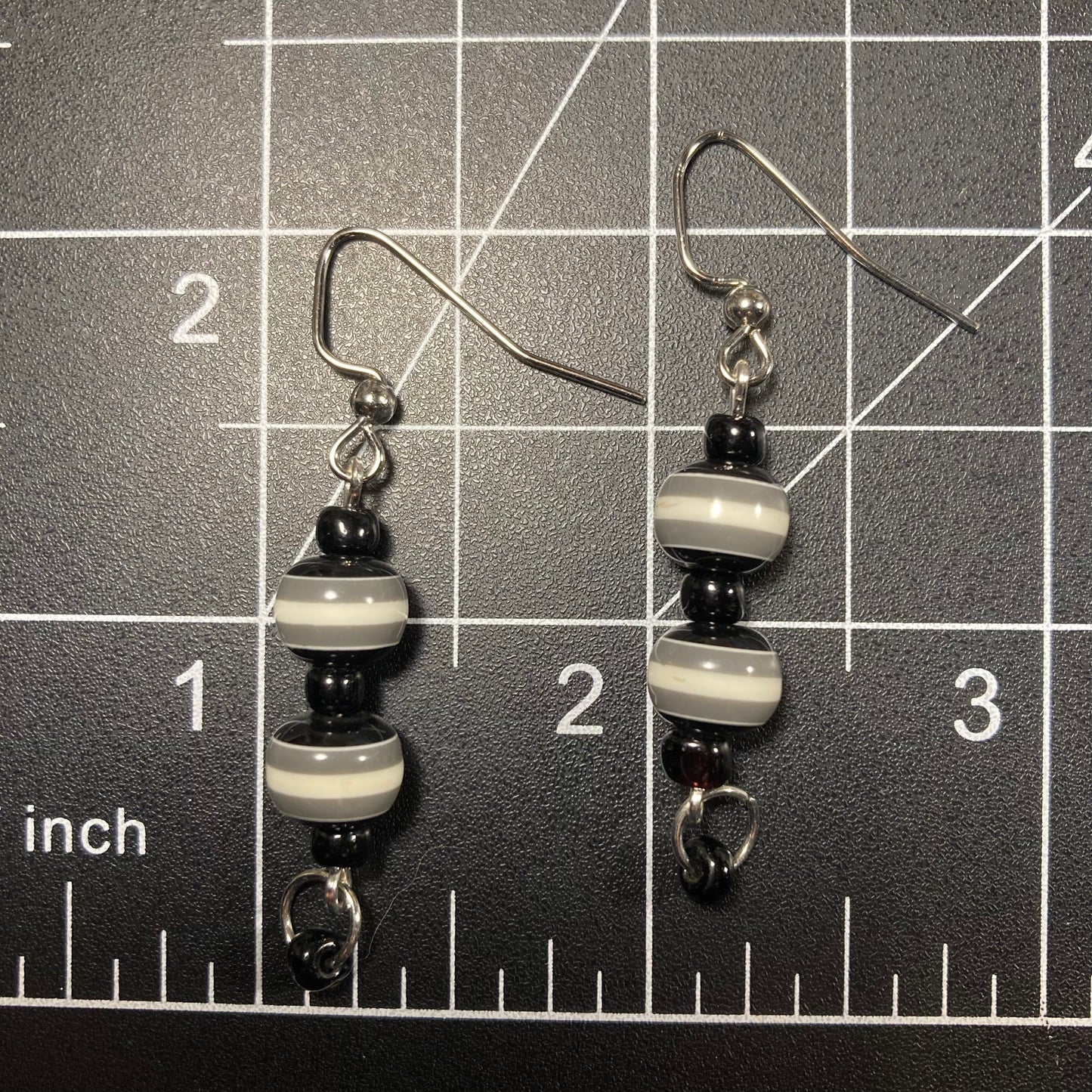 Beaded dangle earrings with black, white and gray stripes