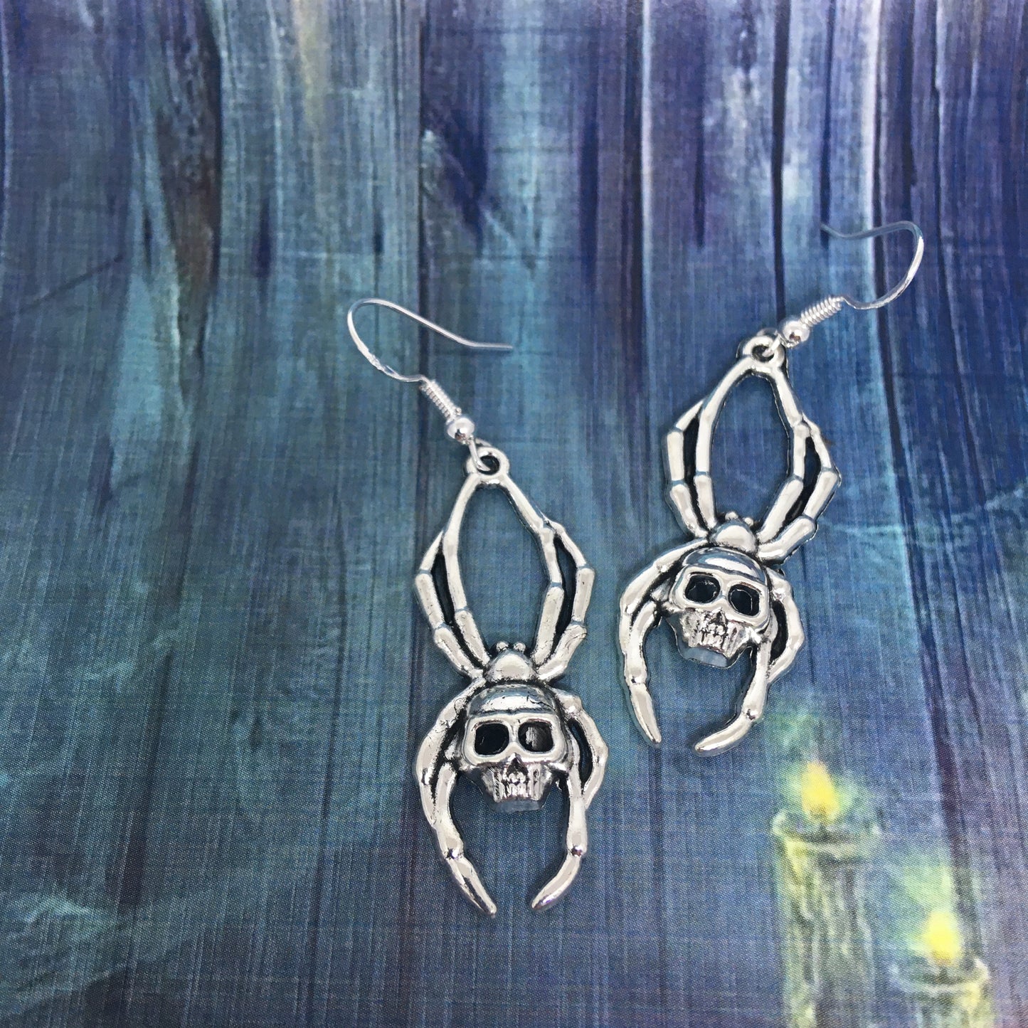 Spider with skull earrings